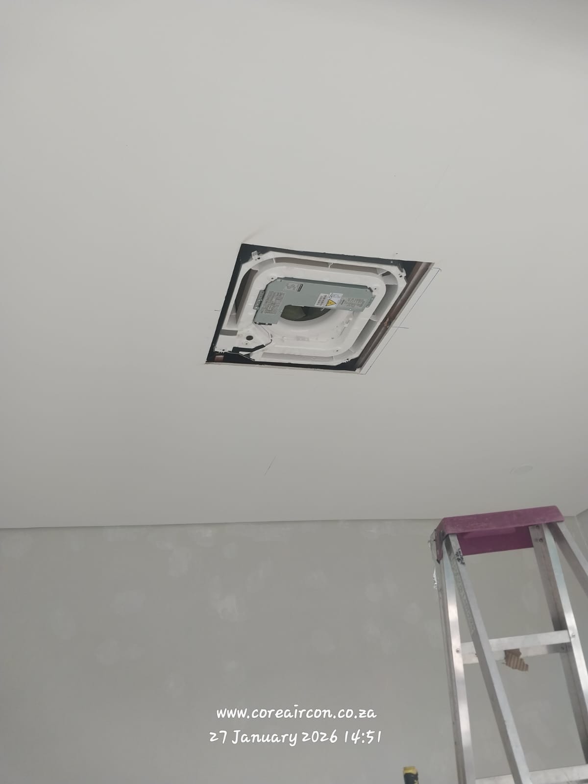 Ceiling cassette air conditioner installation in progress