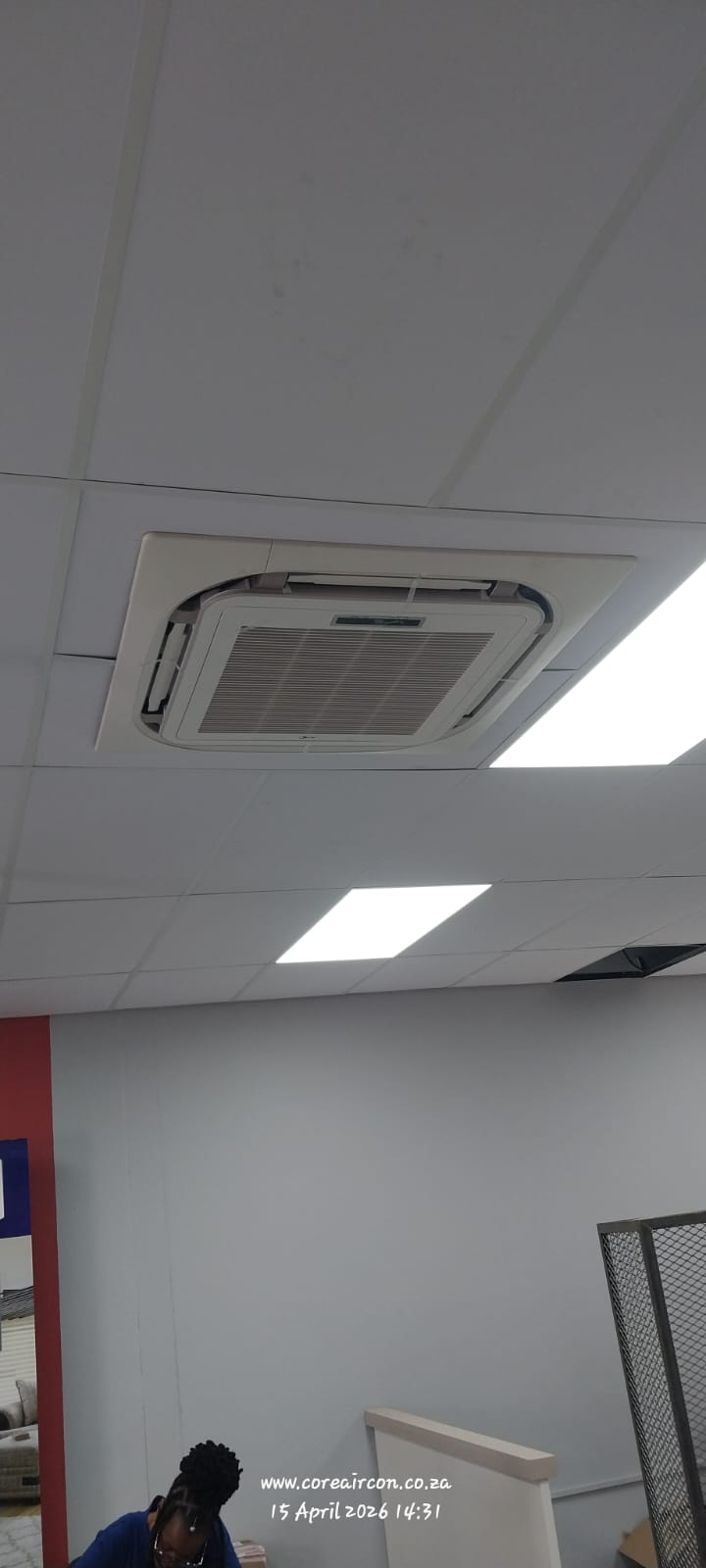 Ceiling cassette air conditioner installed in an office