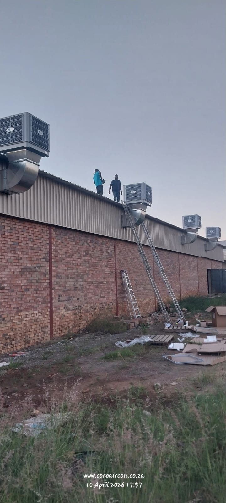 Rooftop evaporative cooling installation at dusk