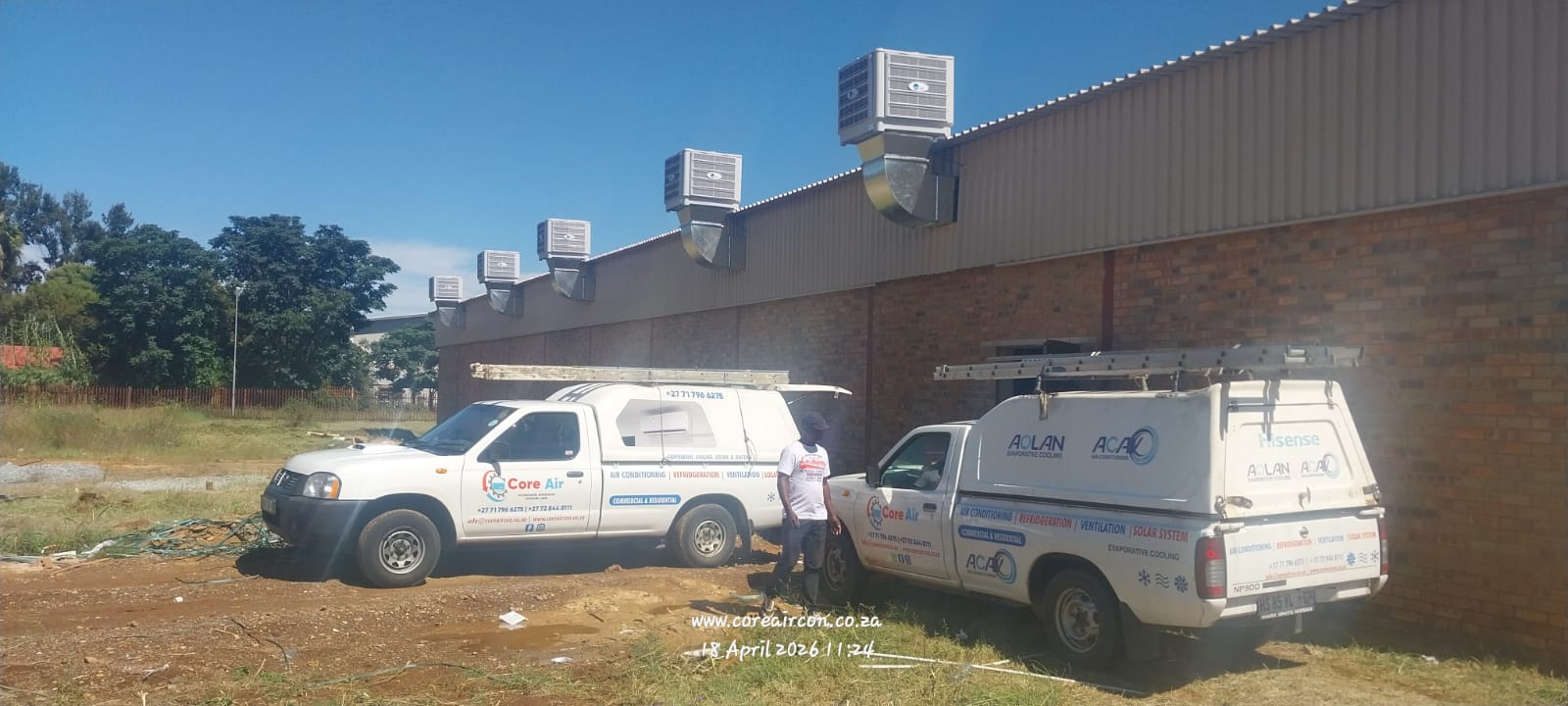 Evaporative cooling units mounted on a commercial building wall