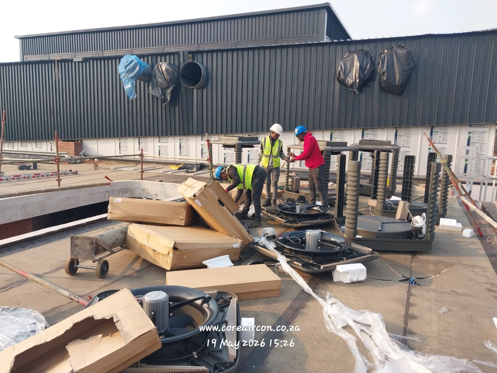 Unpacking and assembling evaporative cooling units on site